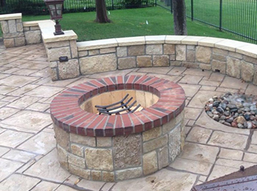 stone firepit with seating wall